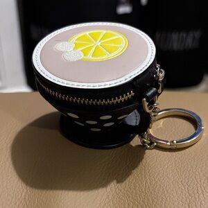 Kate spade Alice in Wonderland Tea Cup zip around keychain